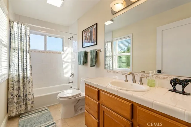 a kitchen with stainless steel appliances granite countertop a sink dishwasher stove and cabinets