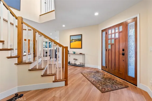 a living room with fireplace furniture and a flat screen tv
