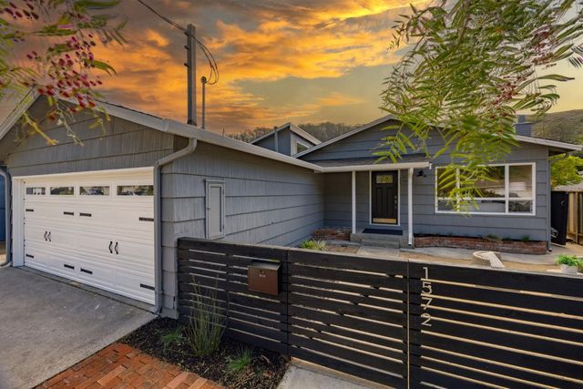 a front view of a house with garage