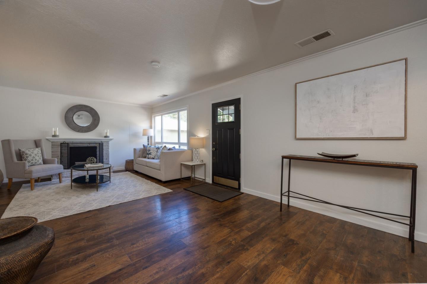 1572 Linda Mar Boulevard Pacifica, CA 94044 - Photo 4 of 25 a living room with furniture and a fireplace