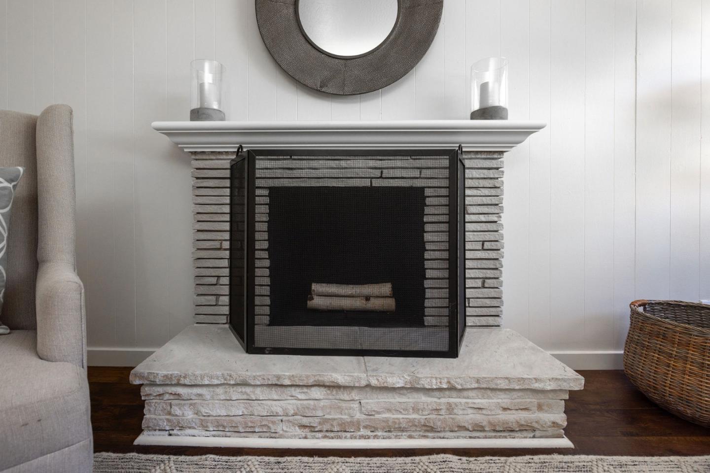 1572 Linda Mar Boulevard Pacifica, CA 94044 - Photo 5 of 25 a fireplace with wooden floor