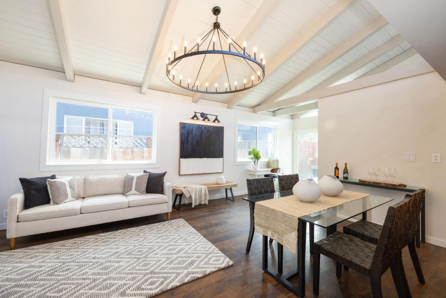 1572 Linda Mar Boulevard Pacifica, CA 94044 - Photo 6 of 25 a living room with furniture a flat screen tv and a large window