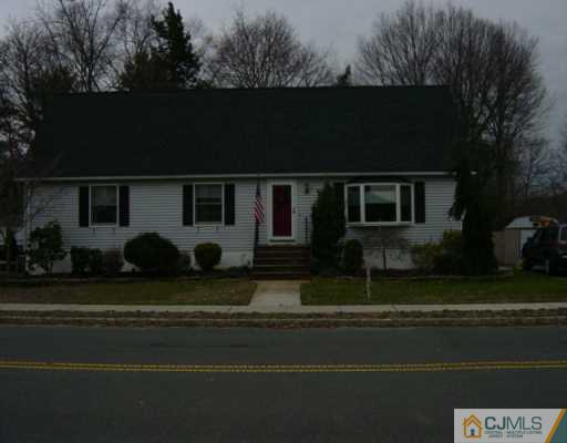 1 John Place Helmetta, NJ 08828 - Photo 1 of 8 a front view of a house with a garden