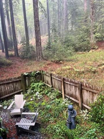 a view of balcony with furniture and wooden deck