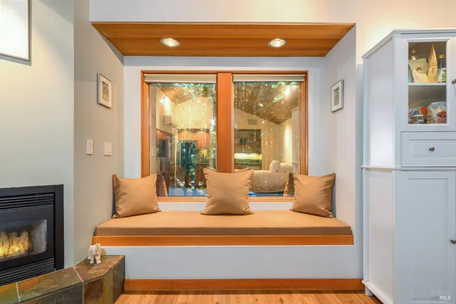 a living room with furniture a clock and a clock