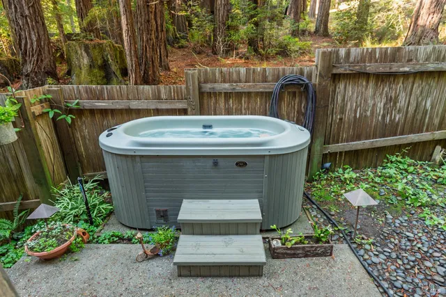 a view of a backyard with a tub