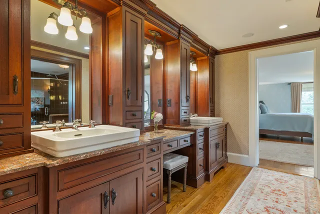 a kitchen with a sink appliances and cabinets