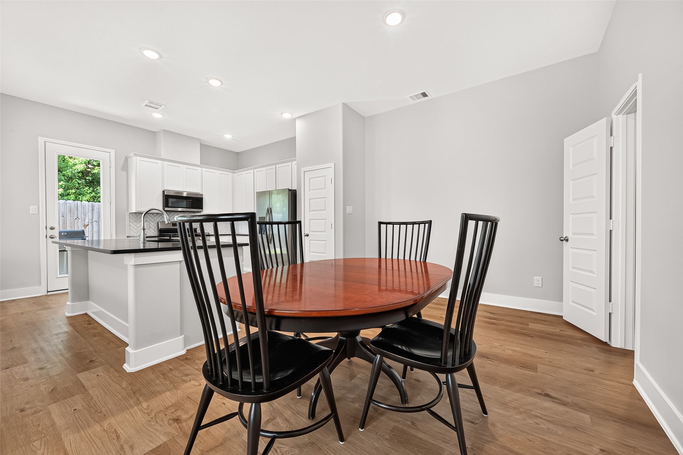 4004 Baja Lane Houston, TX 77045 - Photo 14 of 34 Perfectly positioned just off the main kitchen, this charming breakfast nook is bathed in gorgeous natural light. It offers a warm and inviting atmosphere that is absolutely perfect for enjoying your morning coffee or casual weekday meals.