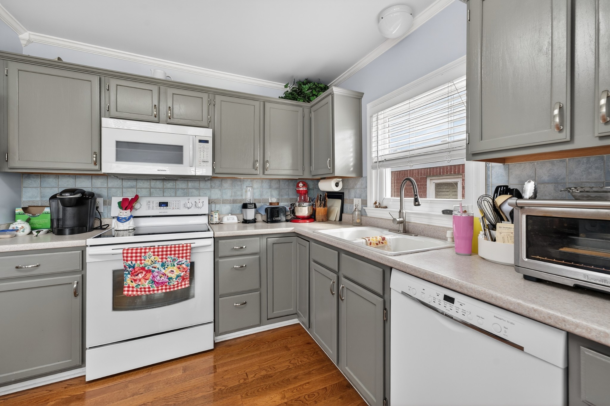 5444 Reagan Run Antioch, TN 37013 - Photo 13 of 46 a kitchen with cabinets appliances a sink and a window