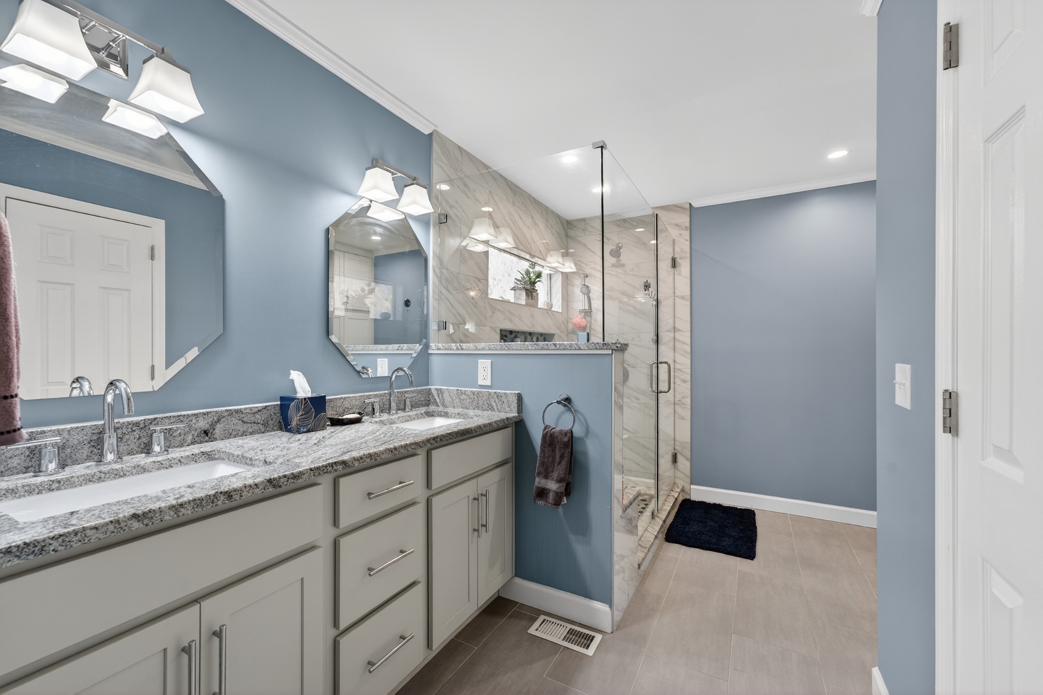 5444 Reagan Run Antioch, TN 37013 - Photo 21 of 46 a spacious bathroom with a granite countertop sink mirror and a shower