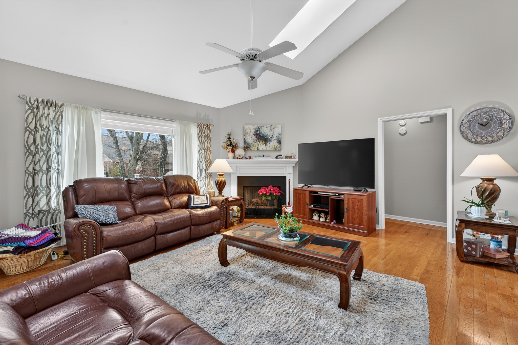 5444 Reagan Run Antioch, TN 37013 - Photo 8 of 46 a living room with furniture a flat screen tv and a fireplace