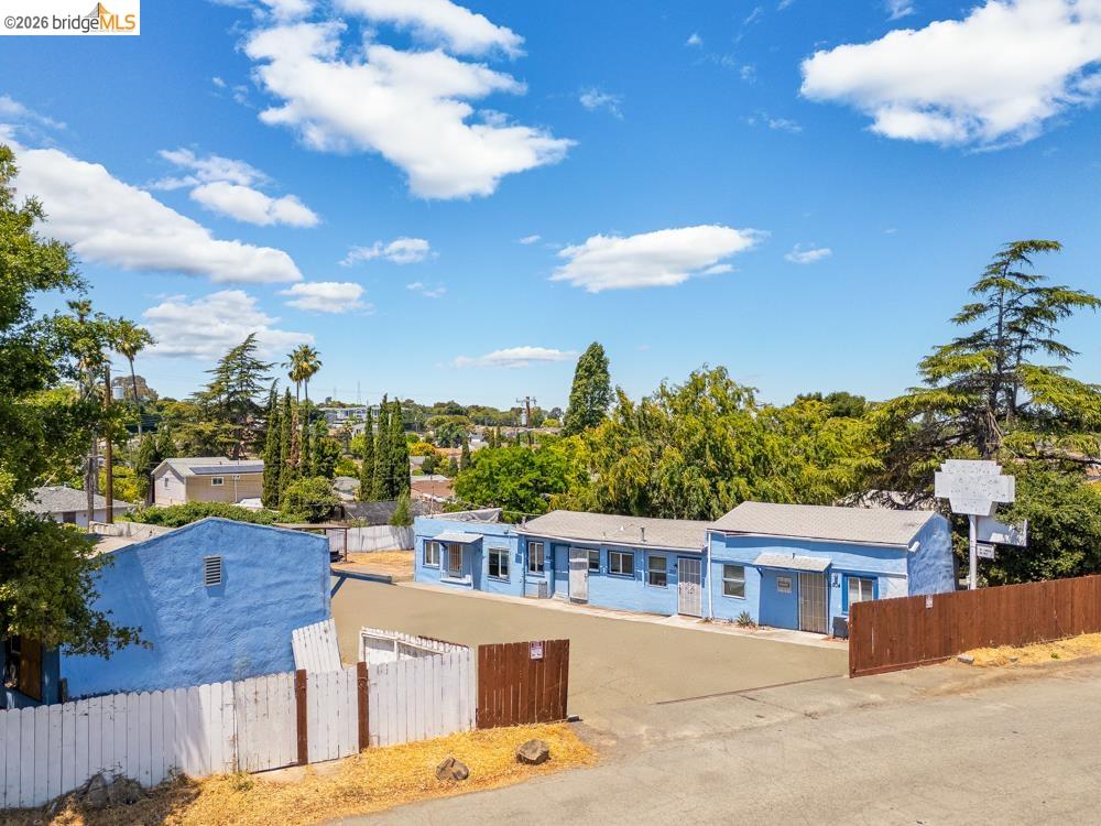 121 Lincoln Road East Vallejo, CA 94590 - Photo 2 of 15 View of building exterior with a fenced front yard