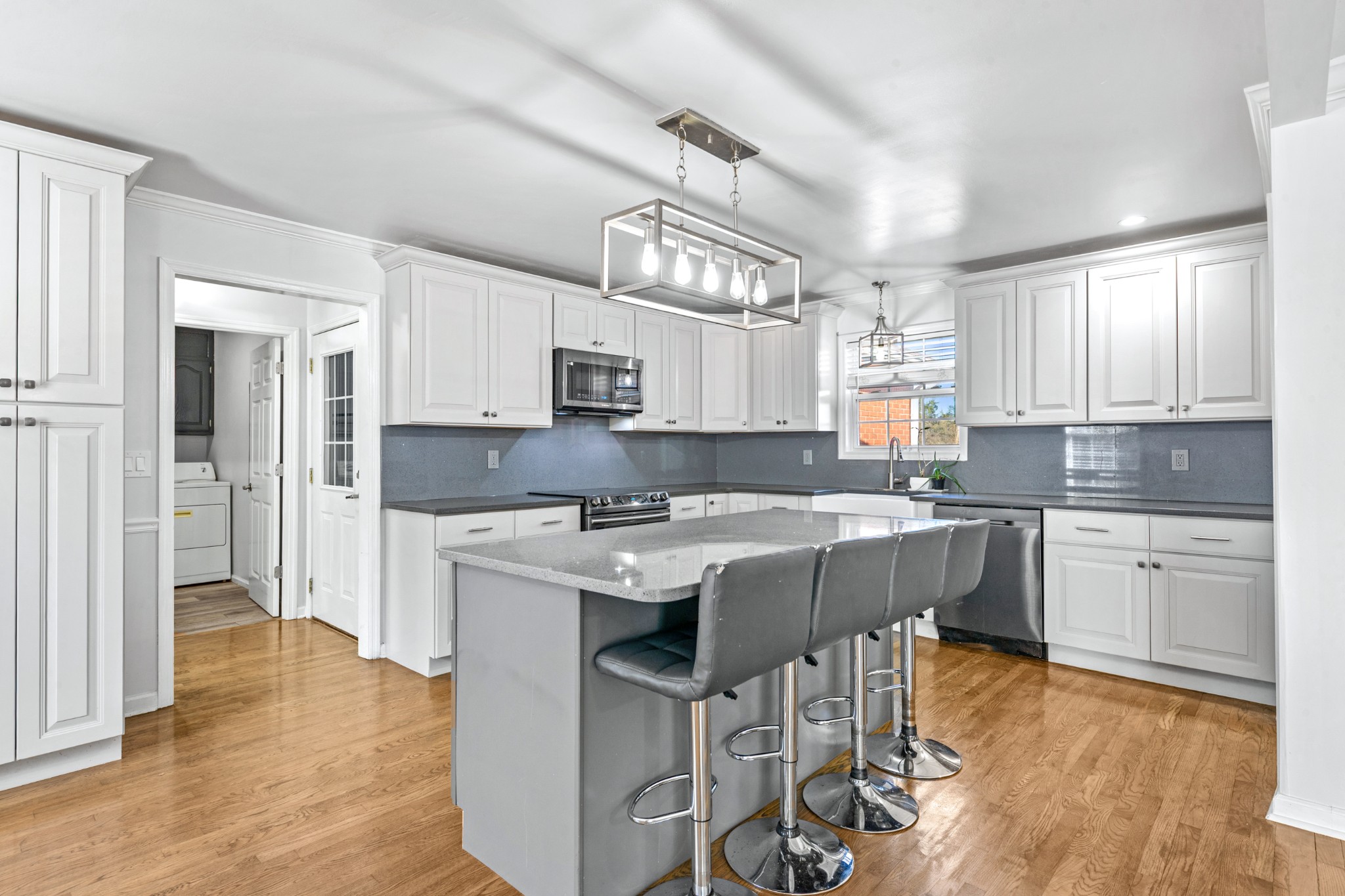 2200 Crescentview Road Pulaski, TN 38478 - Photo 11 of 69 a kitchen with kitchen island granite countertop a sink cabinets and wooden floor