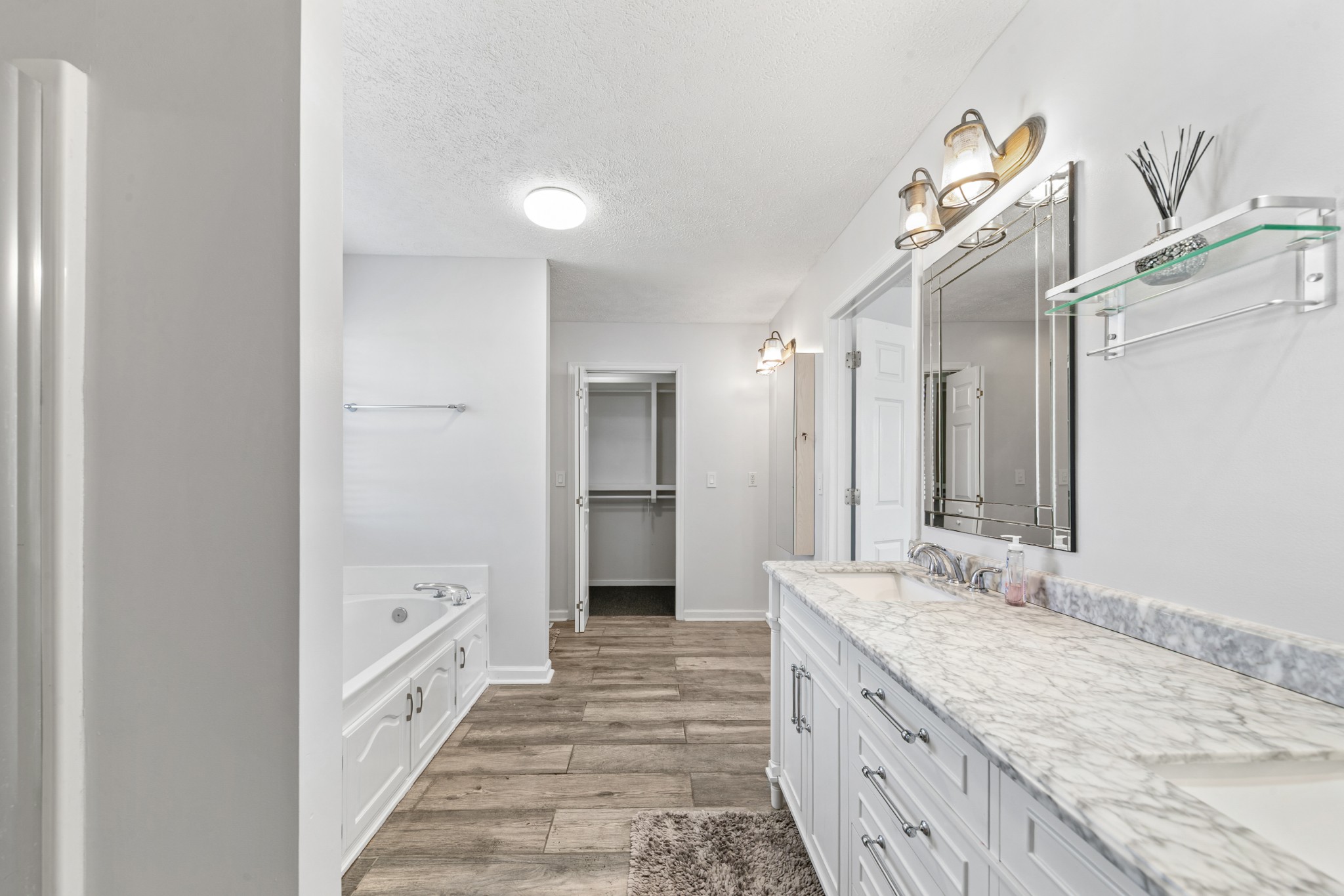 2200 Crescentview Road Pulaski, TN 38478 - Photo 27 of 69 a spacious bathroom with a double vanity sink and a mirror