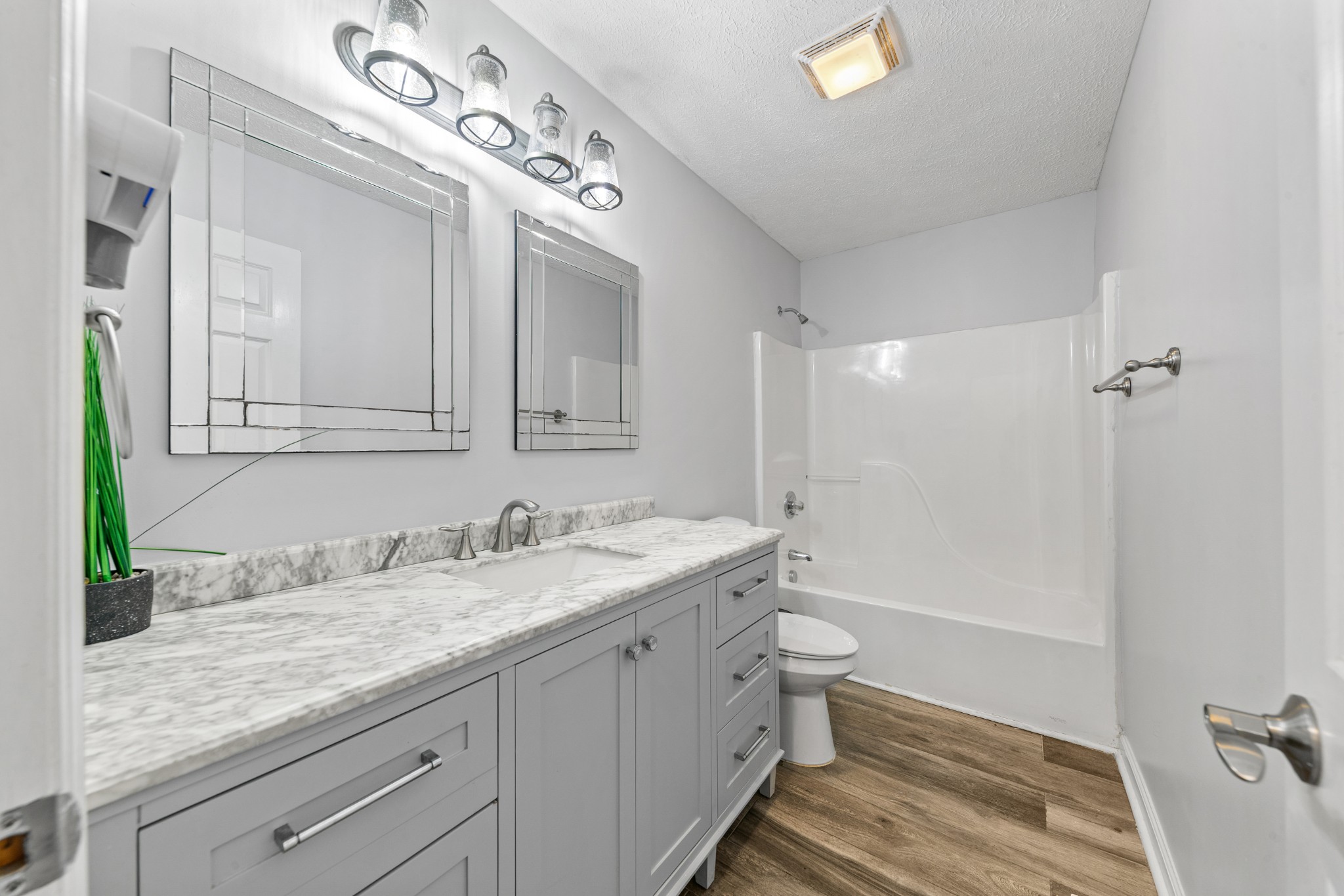2200 Crescentview Road Pulaski, TN 38478 - Photo 31 of 69 a bathroom with a granite countertop sink mirror vanity and toilet