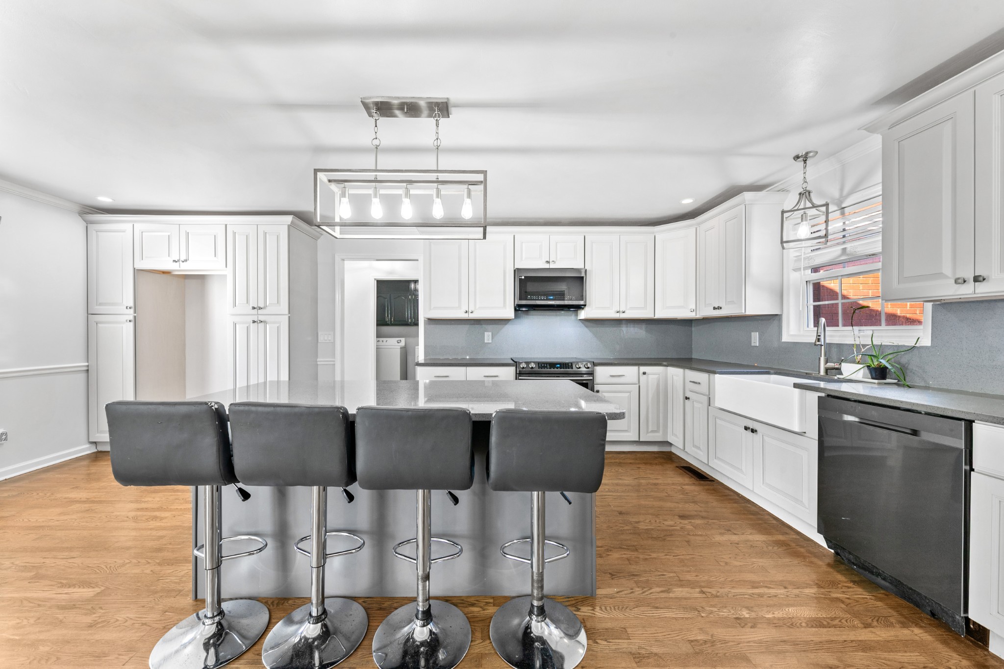 2200 Crescentview Road Pulaski, TN 38478 - Photo 6 of 69 a kitchen with stainless steel appliances kitchen island granite countertop a dining table chairs and a refrigerator
