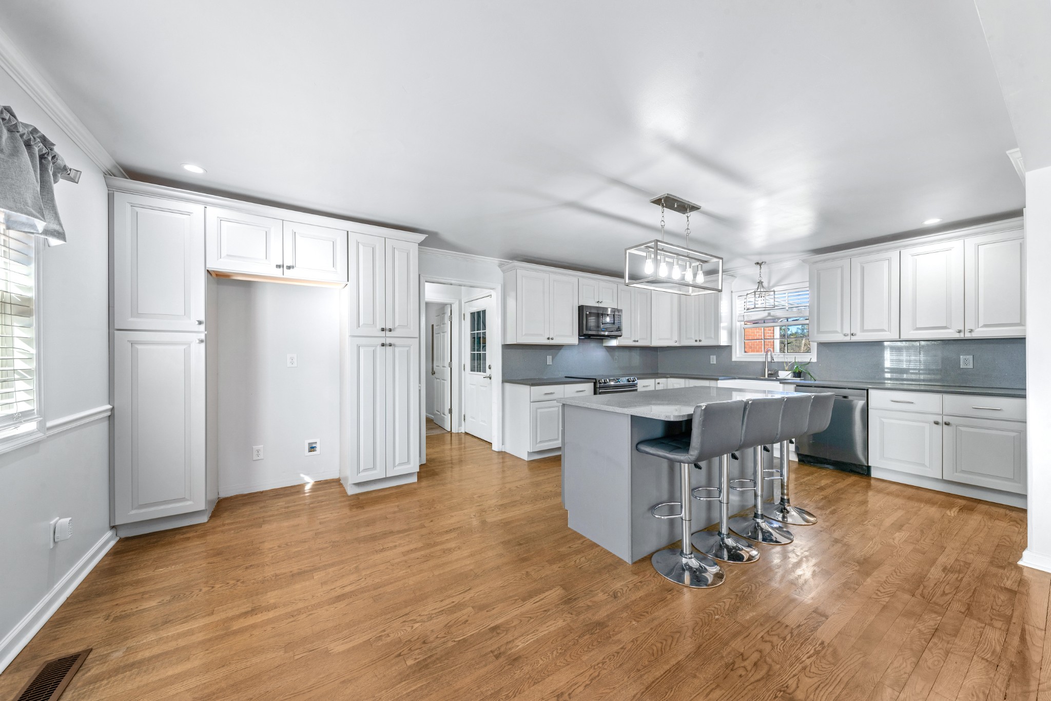 2200 Crescentview Road Pulaski, TN 38478 - Photo 65 of 69 a kitchen with kitchen island a dining table chairs refrigerator and cabinets