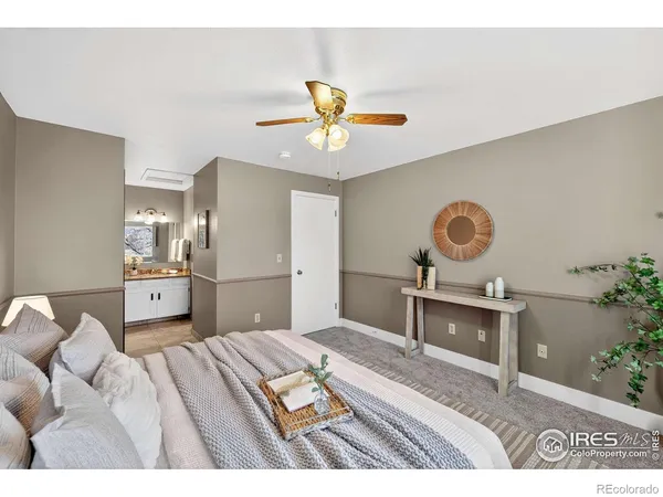 a bedroom with a bed and ceiling fan