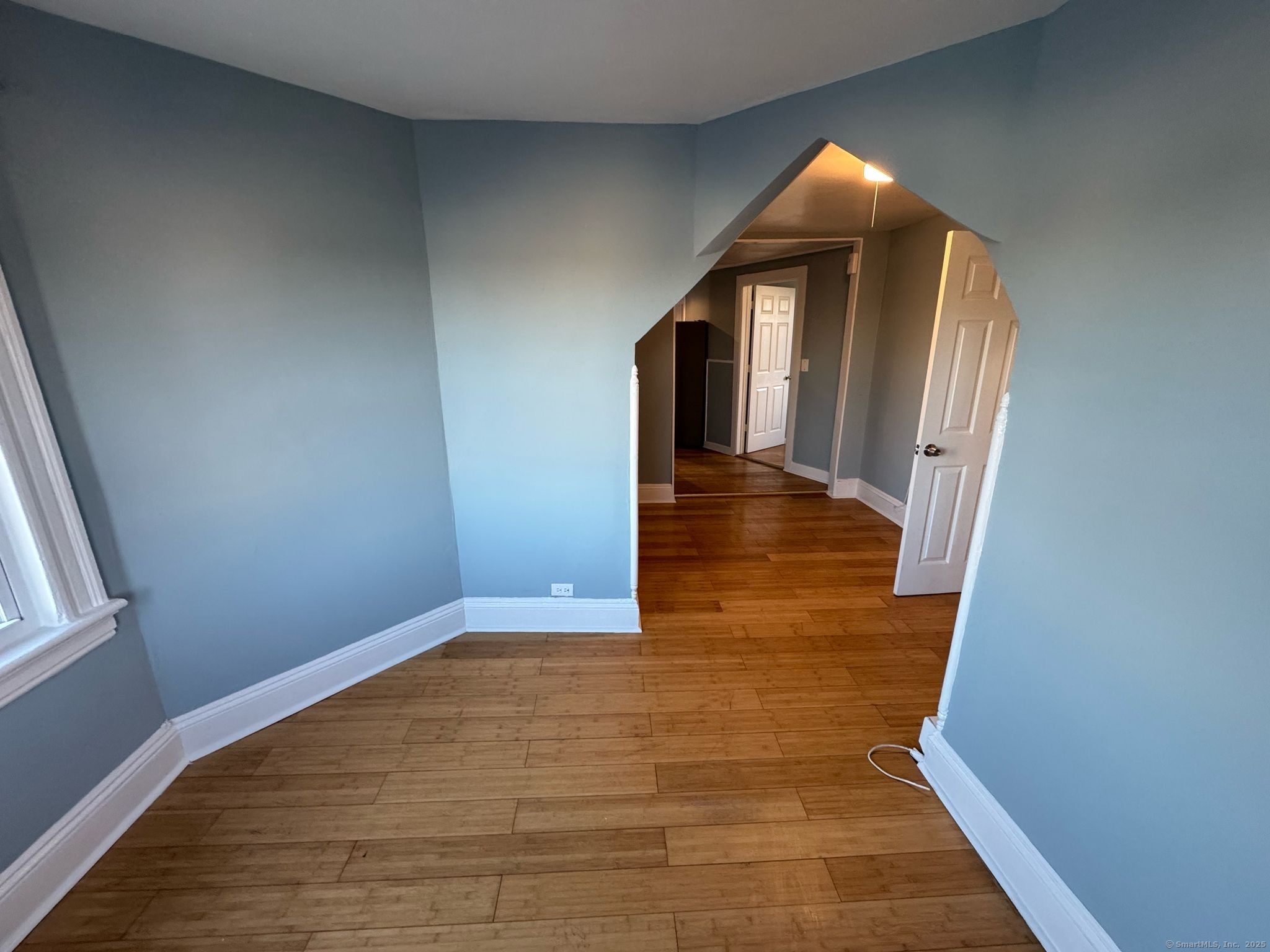 95 Center Street, Unit 1 Bridgeport, CT 06604 - Photo 4 of 4 a view of a hallway to rooms