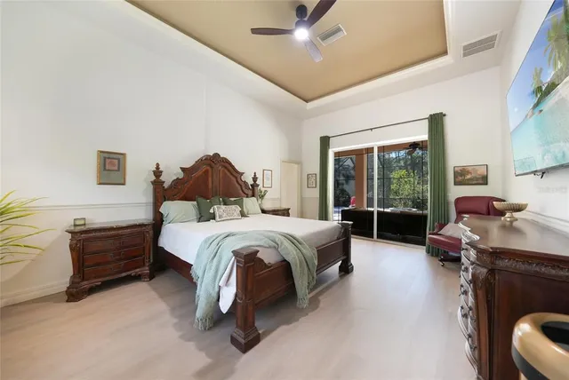 a spacious bedroom with a bed and a couch