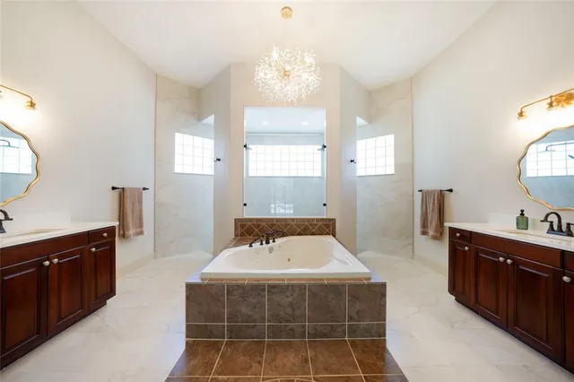 a spacious bathroom with a double vanity sink mirror and