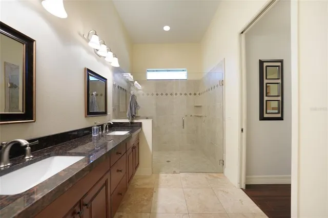 a bedroom with a bed and a potted plant