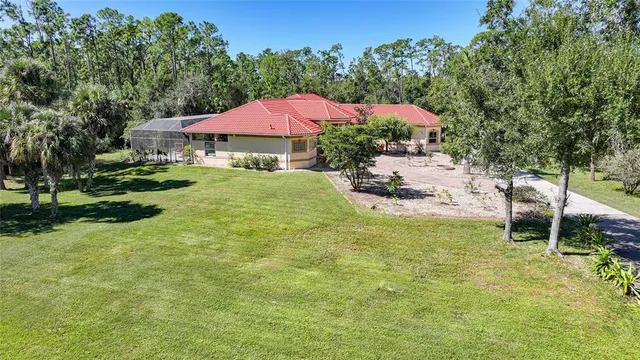 a view of a house with a yard