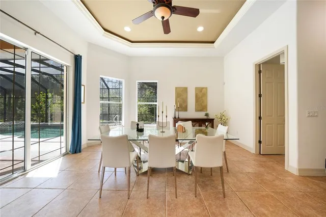 a dining room with furniture and window