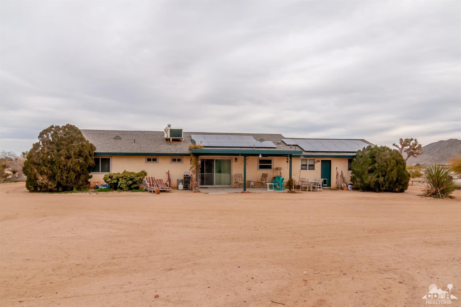 3290 Julcrest Road Yucca Valley, CA 92284 - Photo 2 of 20 front view of a house with a yard