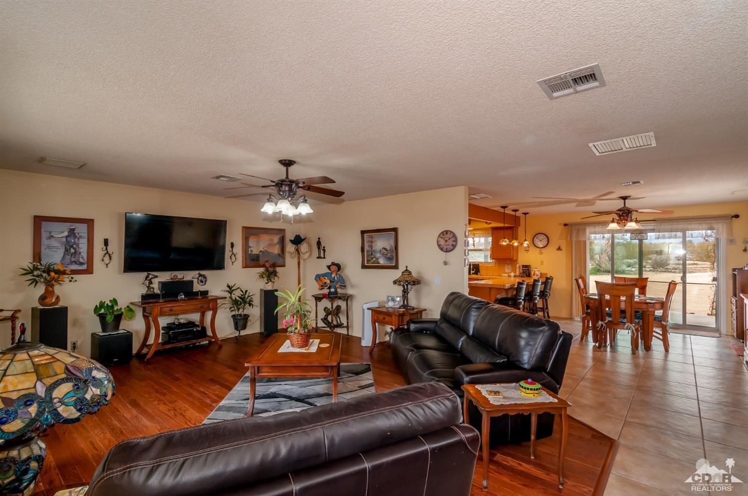 3290 Julcrest Road Yucca Valley, CA 92284 - Photo 5 of 20 a living room with furniture and a flat screen tv