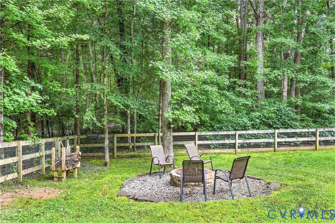 2986 Ballsville Road Powhatan, VA 23139 - Photo 18 of 43 Fenced backyard with a fire pit