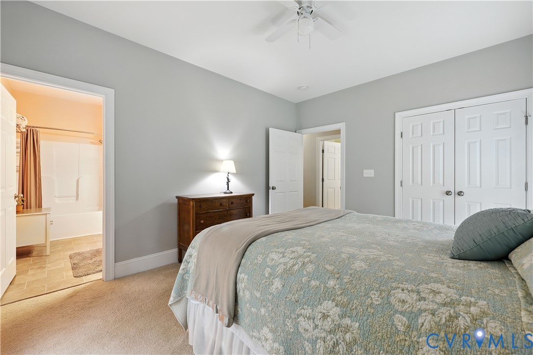 2986 Ballsville Road Powhatan, VA 23139 - Photo 36 of 43 Bedroom featuring light carpet, a closet, connecte