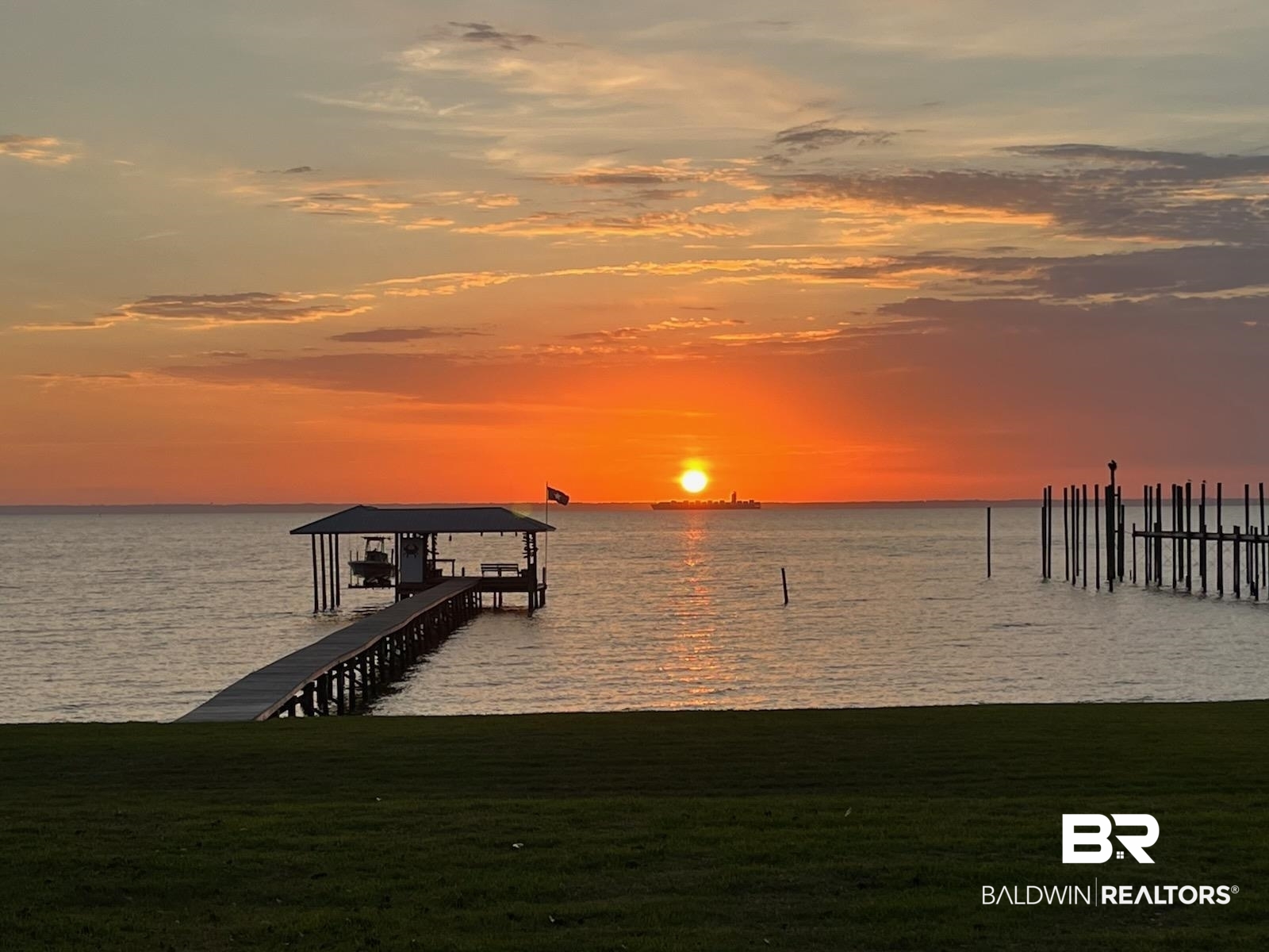 7015 Bay Road Mobile, AL 36605 - Photo 42 of 53 Dock area featuring a water view, boat lift, and a lawn