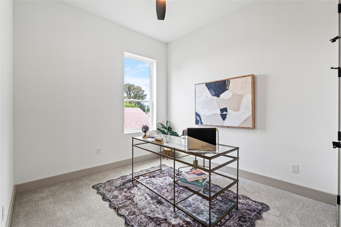 2950 Pitzlin Street Houston, TX 77023 - Photo 17 of 37 Whether you’re taking meetings or finding a moment of focus, this light-filled flex space offers the perfect setup for a home office, reading nook, or creative retreat—complete with plush carpet, modern trim, and serene window views.