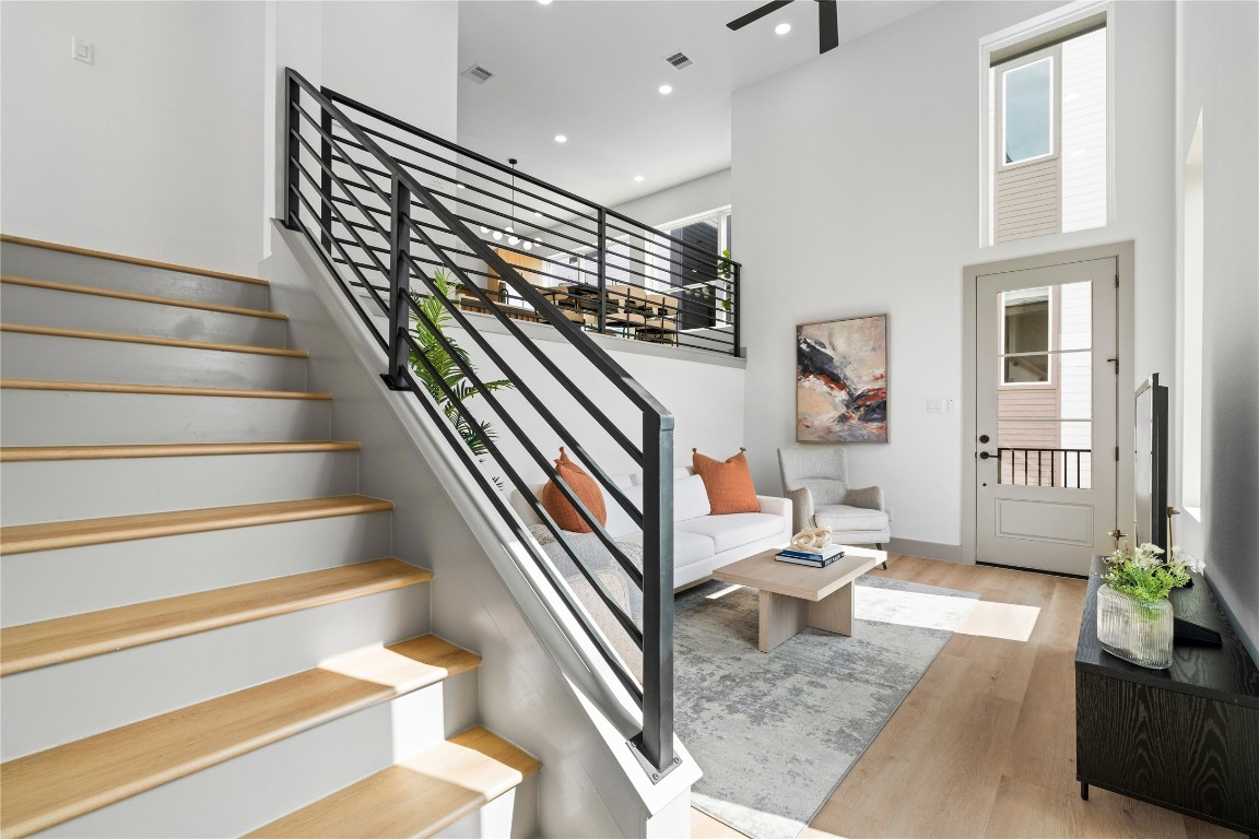 2950 Pitzlin Street Houston, TX 77023 - Photo 5 of 37 Soaring 18-ft ceilings and a modern split-level layout create an airy, elevated feel in this stylish living space—perfect for both relaxing and entertaining.