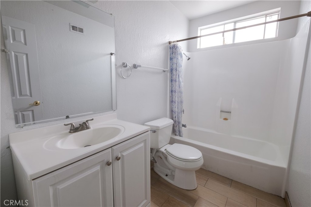 3771 Harvill Lane Riverside, CA 92503 - Photo 26 of 53 a bathroom with a sink toilet and shower