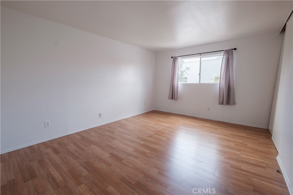 3771 Harvill Lane Riverside, CA 92503 - Photo 29 of 53 an empty room with wooden floor and windows