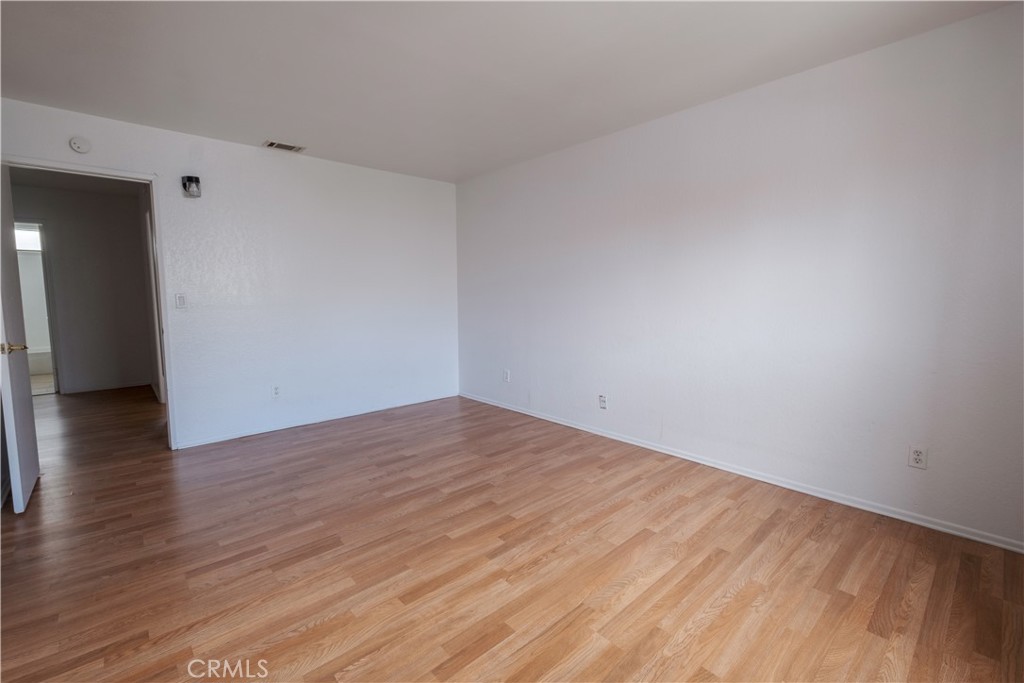 3771 Harvill Lane Riverside, CA 92503 - Photo 30 of 53 a view of empty room with wooden floor