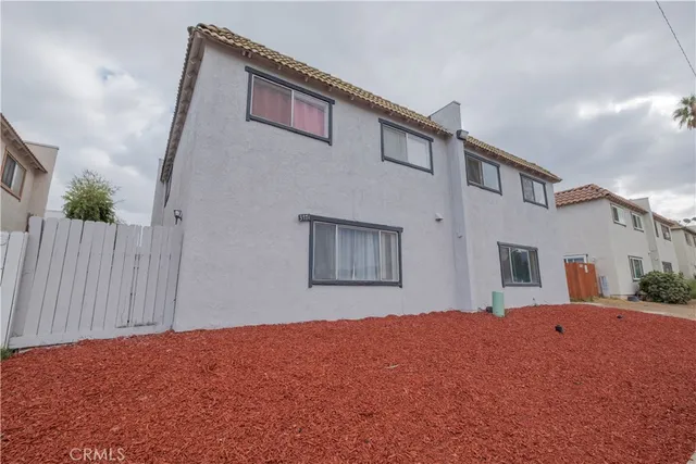 a front view of a house with a big yard