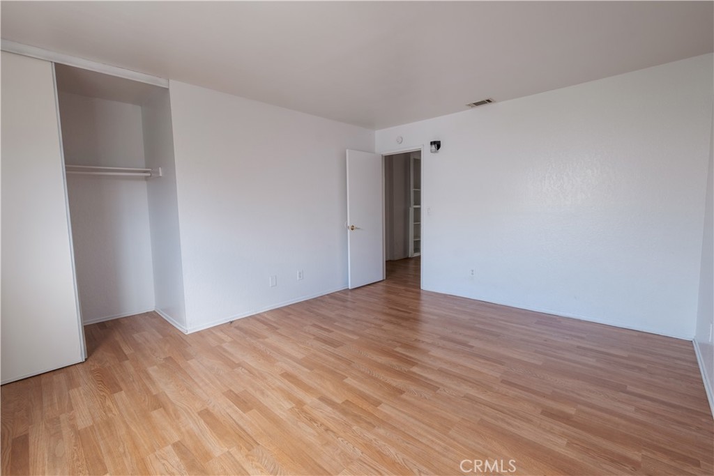 3771 Harvill Lane Riverside, CA 92503 - Photo 31 of 53 a view of an empty room with wooden floor