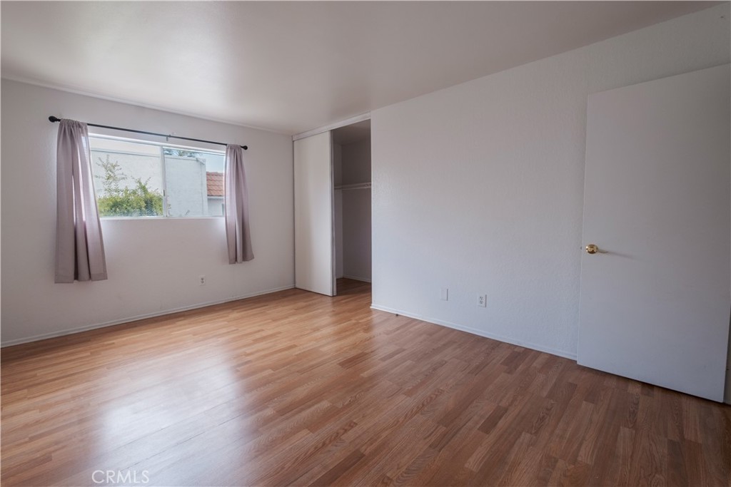 3771 Harvill Lane Riverside, CA 92503 - Photo 32 of 53 a view of an empty room with wooden floor and a window