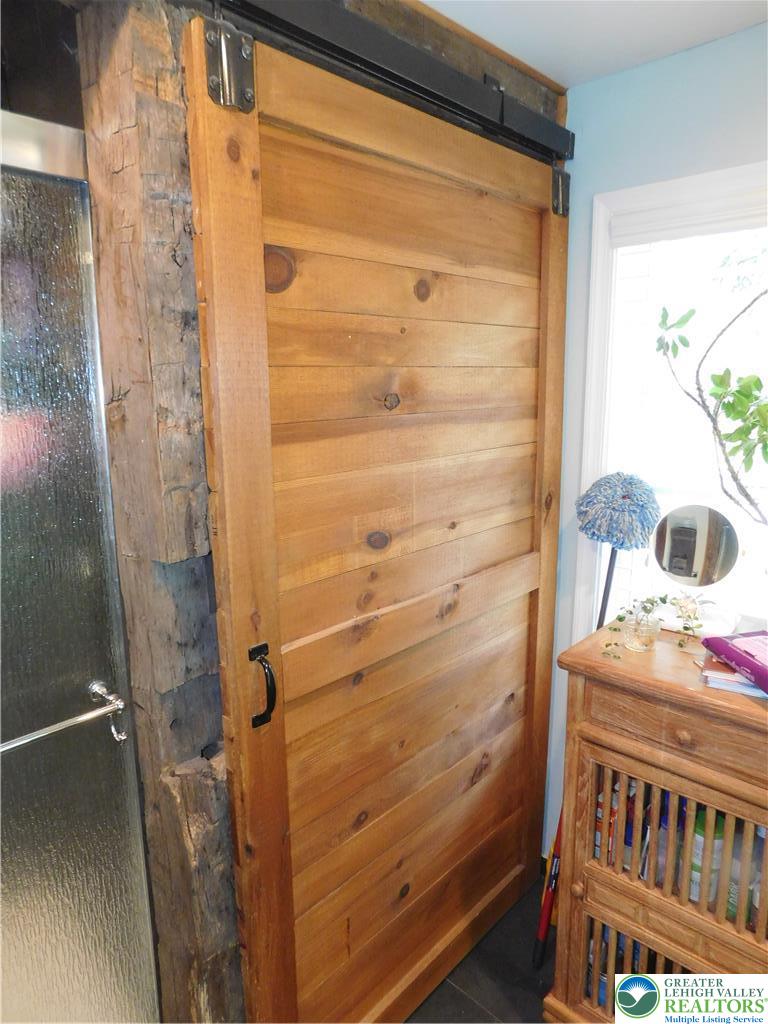 41 Reeder Street Mount Pocono, PA 18344 - Photo 32 of 41 A sliding wood barn door conceals the washer and dryer.