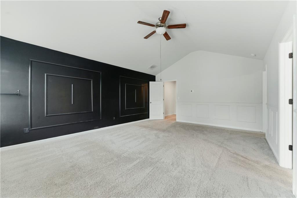 7492 Knoll Hollow Road Lithonia, GA 30058 - Photo 15 of 30 a view of a big room with carpet