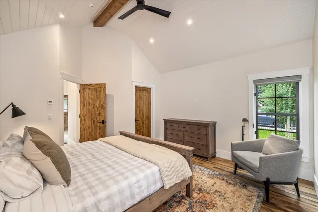 a bedroom with a bed and a couch