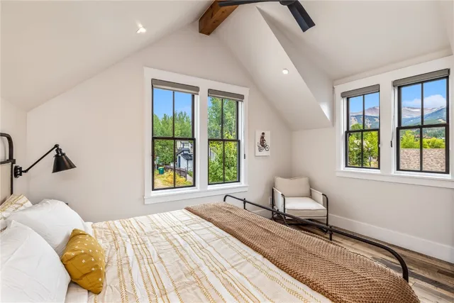 a bedroom with a bed and window