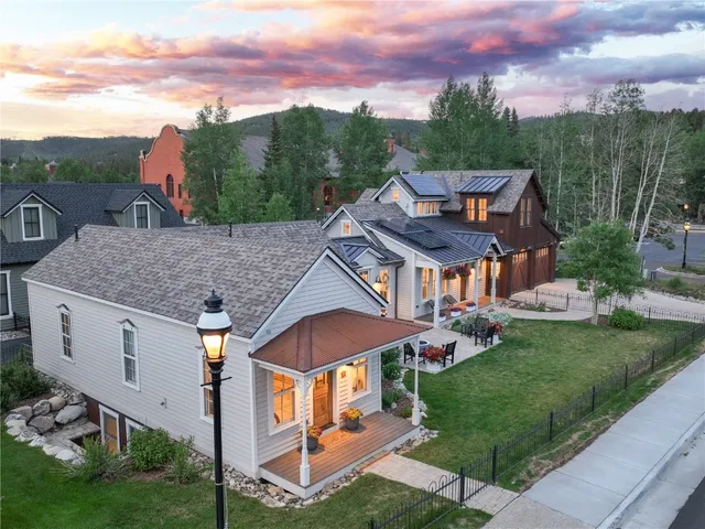 an aerial view of a house with a big yard
