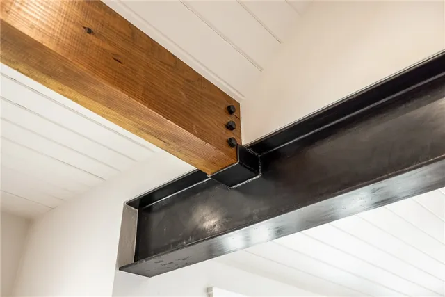 an aerial view of house yard and swimming pool