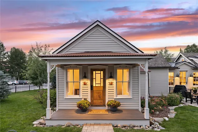a front view of house with a garden