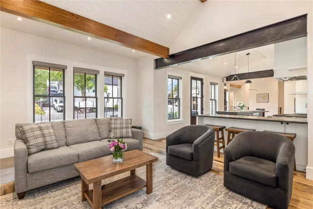 a living room with furniture and windows