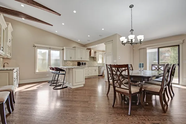 a view of a dining room with furniture window and wooden floor